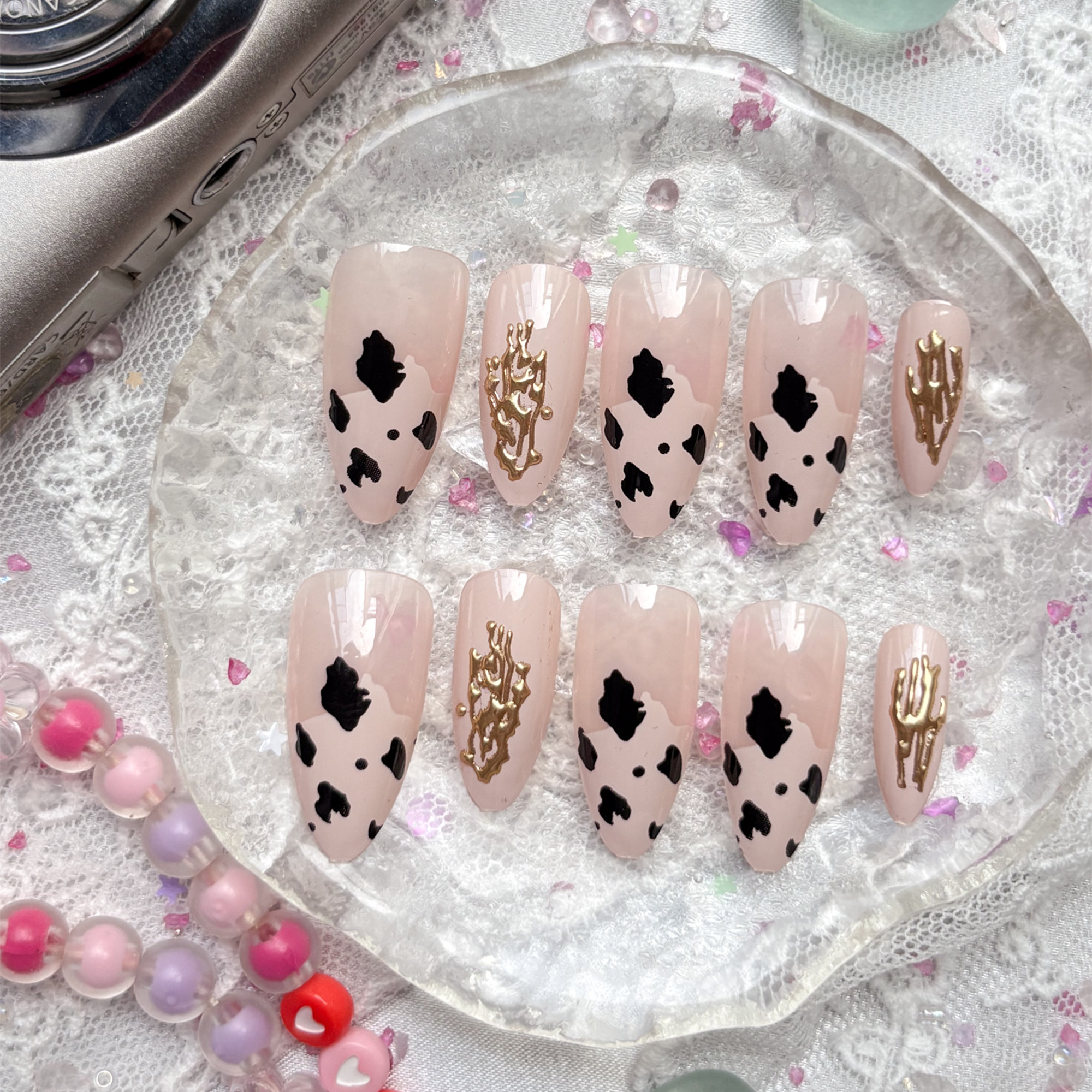 Custom Press-On Nails – Cow Print with Gold Doodle Charm on Beige Base | Wynzy Pops Nails