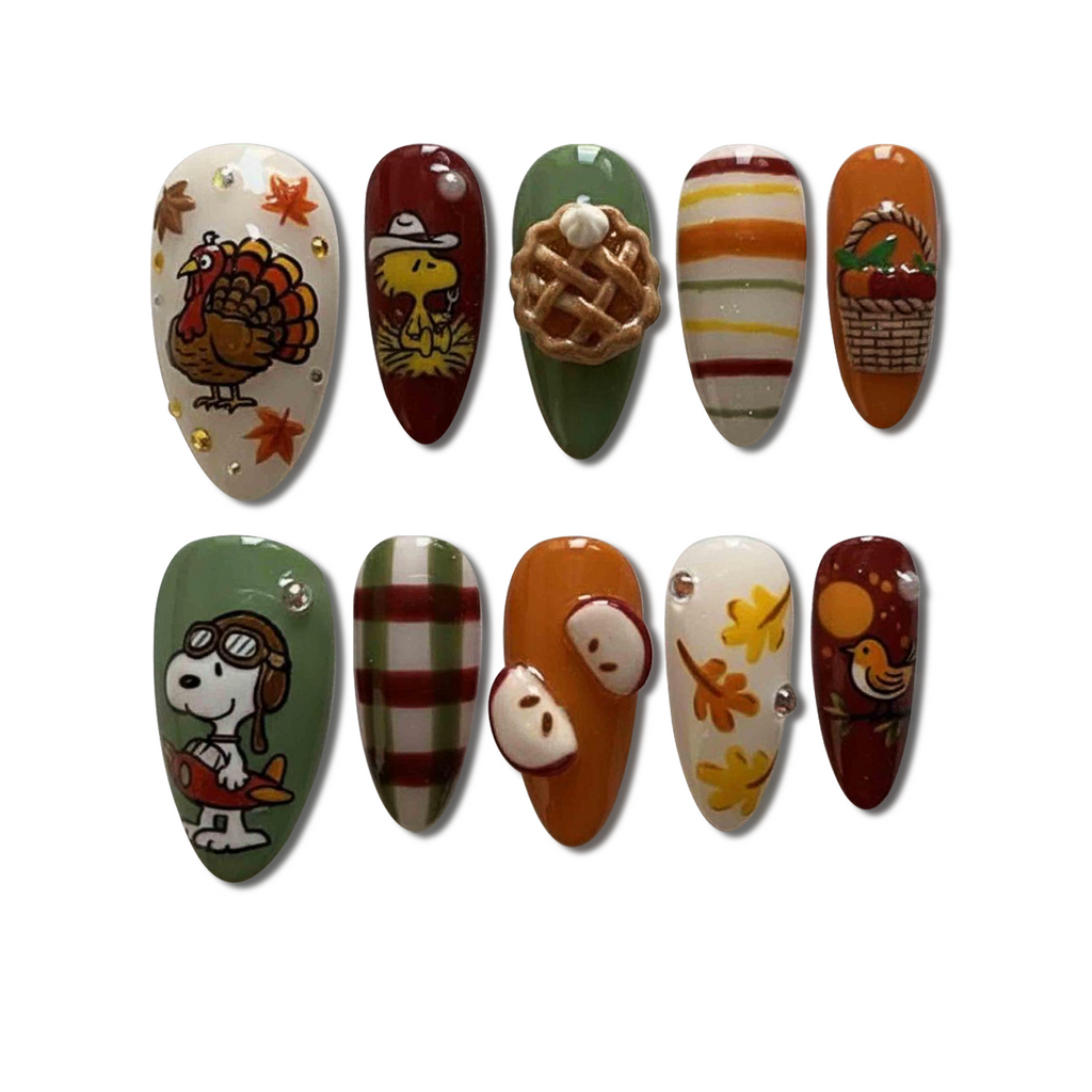 Custom Thanksgiving Press-On Nails featuring Snoopy, turkey, and pumpkin pie nail art – Wynzy Pops Nails™