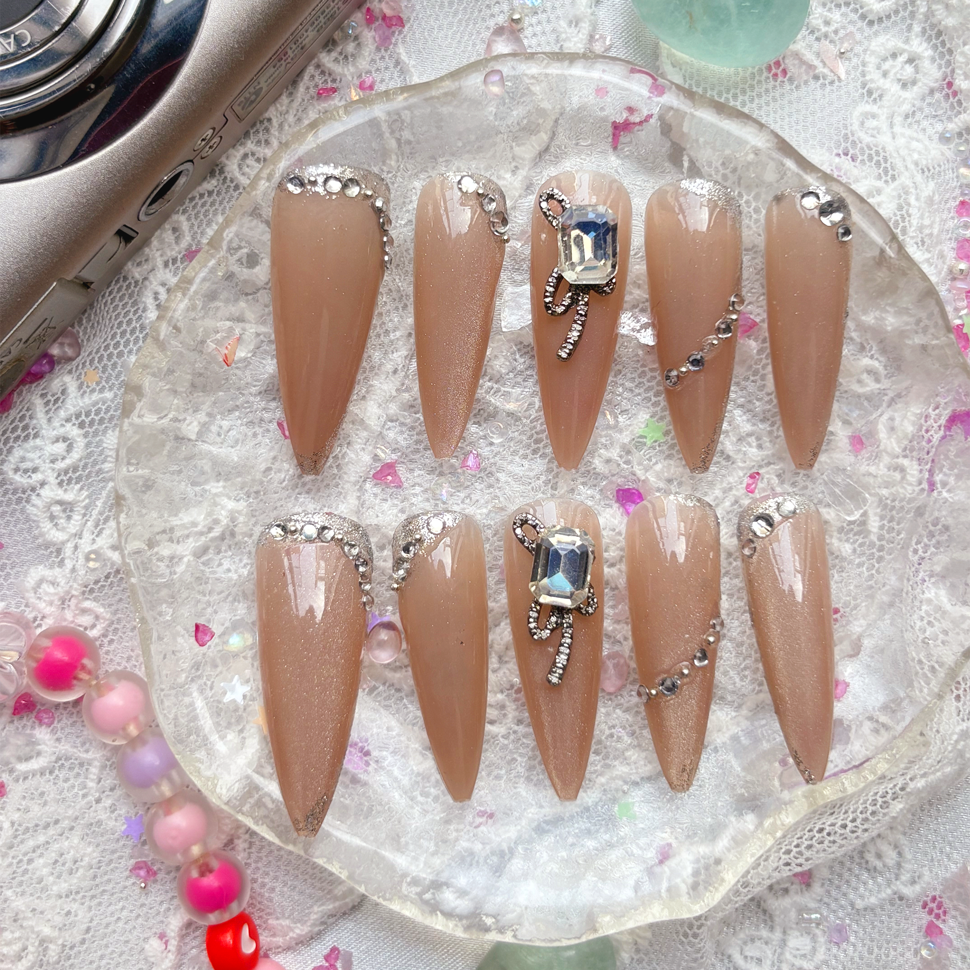 Press-On Nails – Nude Stiletto with Rhinestone & Crystal Bow Accents | Elegant Glam Luxury | Wynzy Pops Nails