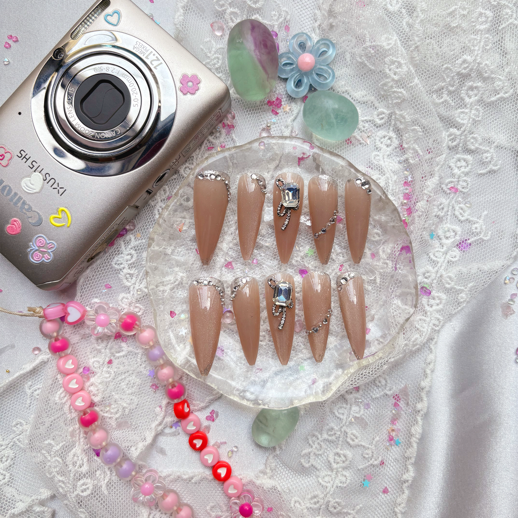 Press-On Nails – Nude Stiletto with Rhinestone & Crystal Bow Accents | Elegant Glam Luxury | Wynzy Pops Nails