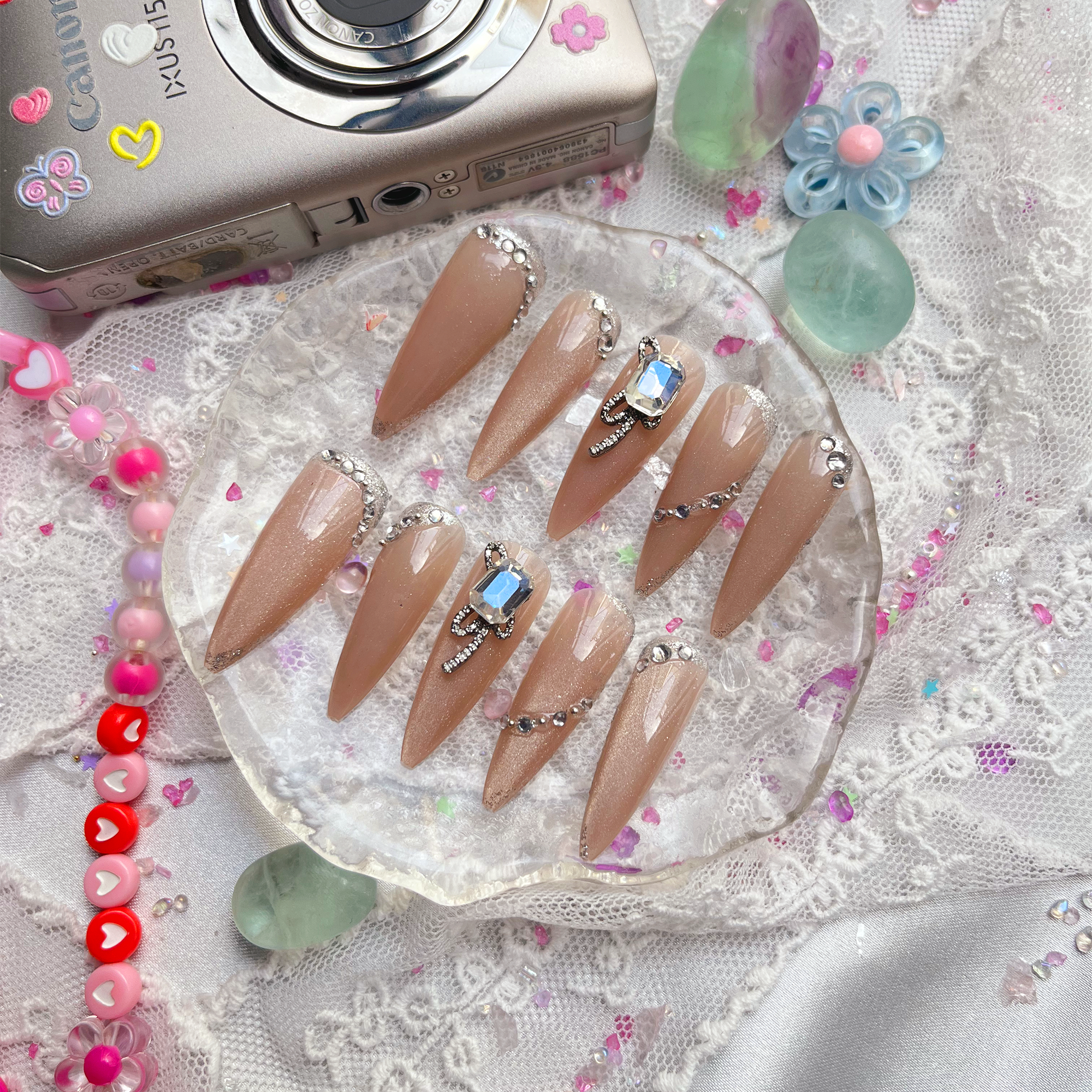 Press-On Nails – Nude Stiletto with Rhinestone & Crystal Bow Accents | Elegant Glam Luxury | Wynzy Pops Nails