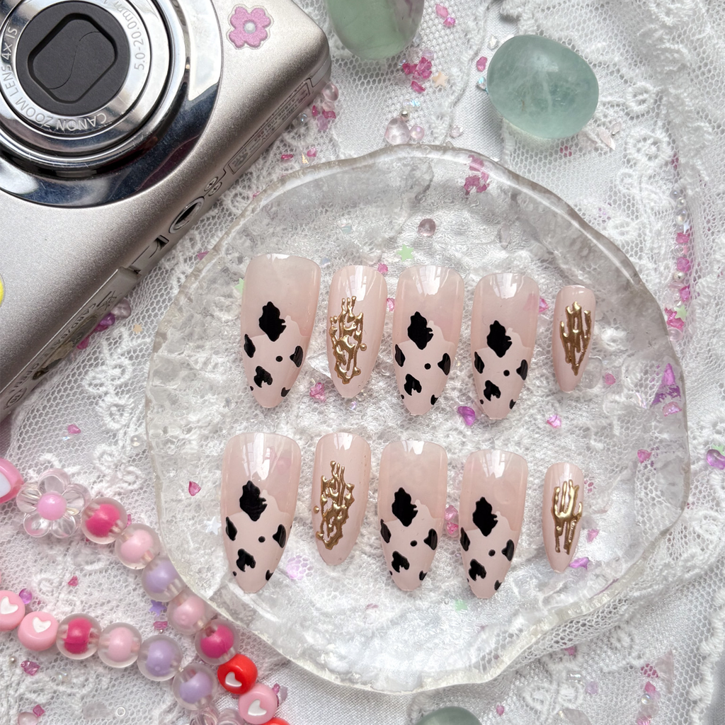 Custom Press-On Nails – Cow Print with Gold Doodle Charm on Beige Base | Wynzy Pops Nails
