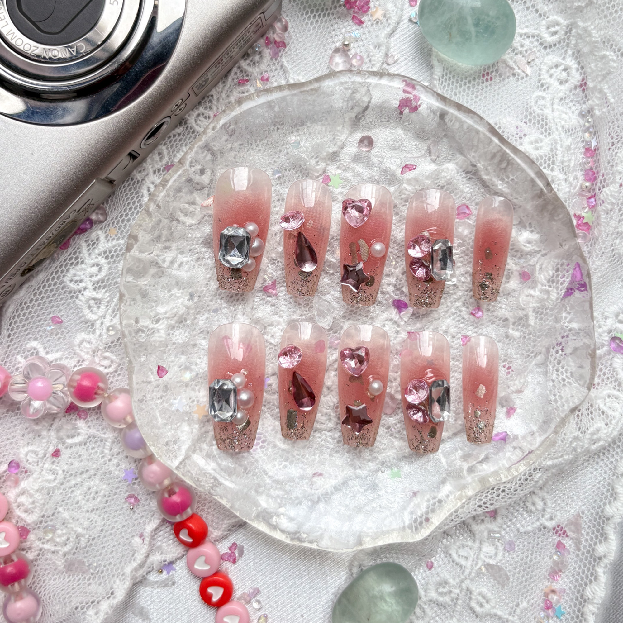 Press-On Nails – Pink Glitter with Clear Tips, Pearl & Rhinestone Charms | Long Coffin Glam | Wynzy Pops Nails