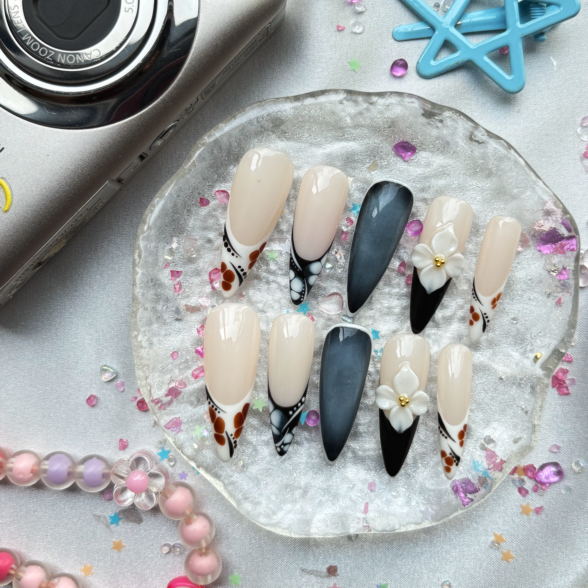 Personalized Nude & Black French Stiletto Nails | 3D White Flower | Abstract Dot Design | Modern Chic Nail Trend 2025