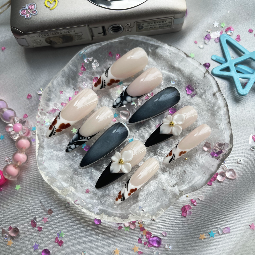Personalized Nude & Black French Stiletto Nails | 3D White Flower | Abstract Dot Design | Modern Chic Nail Trend 2025