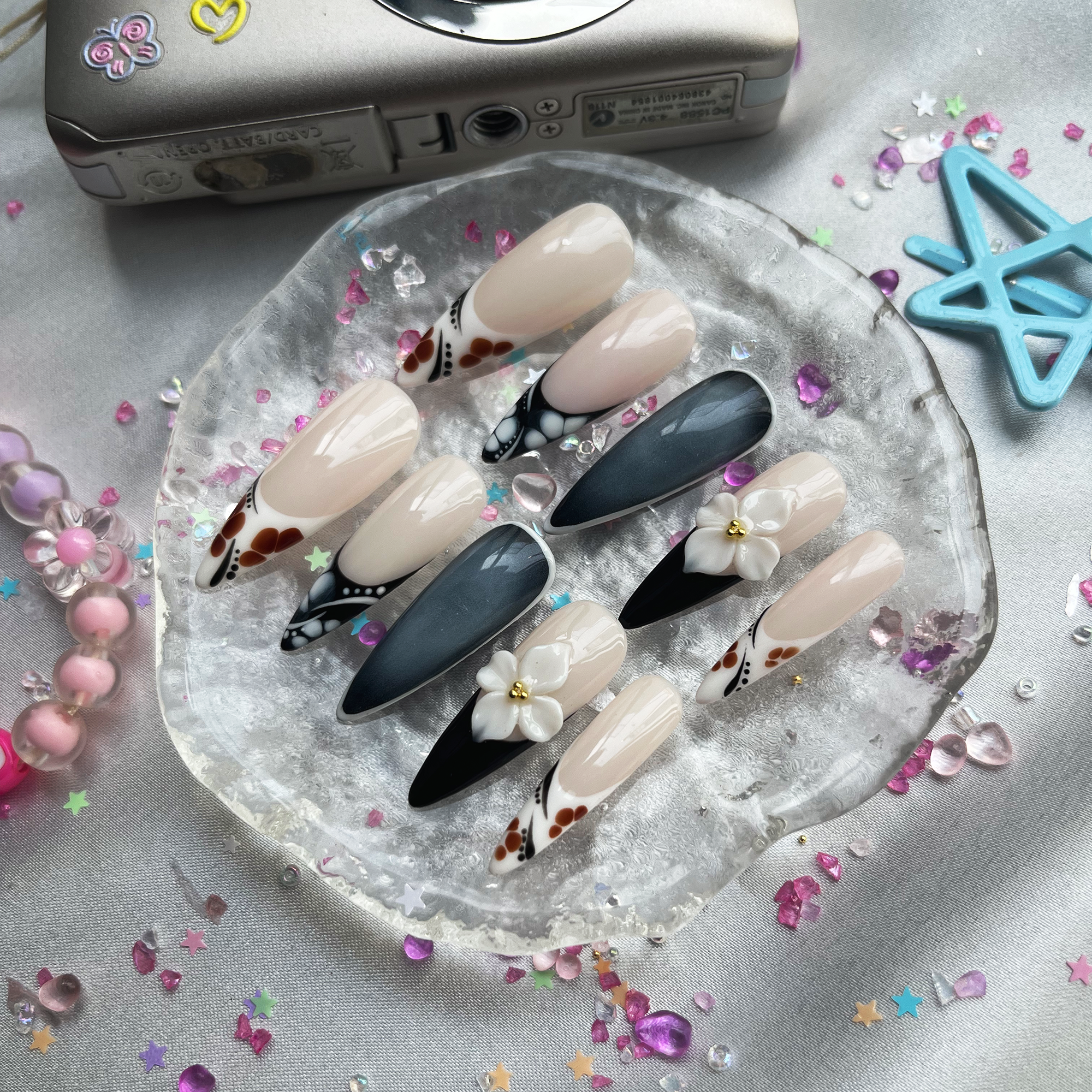 Personalized Nude & Black French Stiletto Nails | 3D White Flower | Abstract Dot Design | Modern Chic Nail Trend 2025