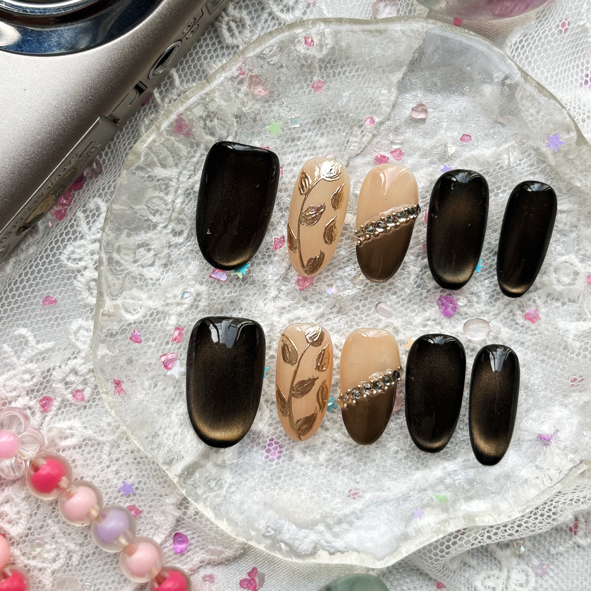 Custom Press-On Nails – Black Cat-Eye & Nude with Gold Leaf & Rhinestones | Fall-Inspired Almond Nails | Wynzy Pops Nails