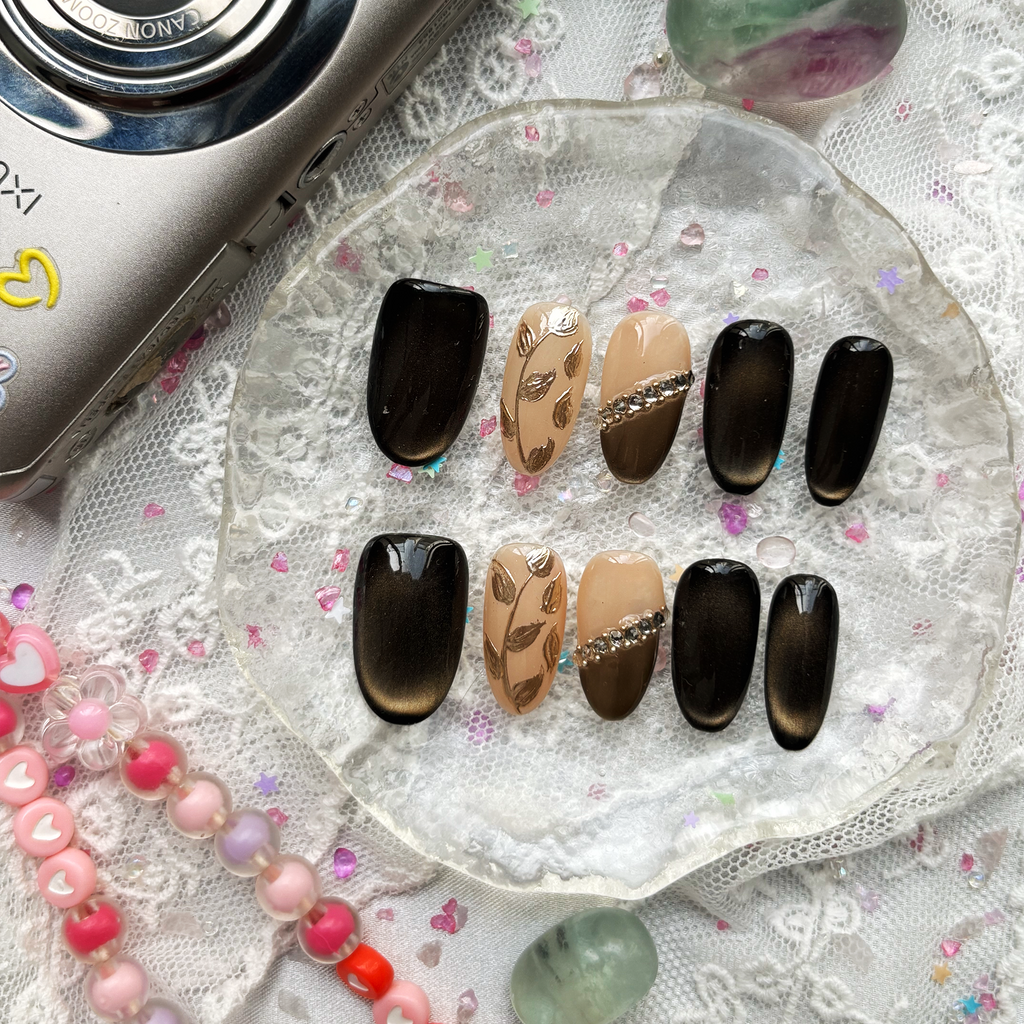 Custom Press-On Nails – Black Cat-Eye & Nude with Gold Leaf & Rhinestones | Fall-Inspired Almond Nails | Wynzy Pops Nails